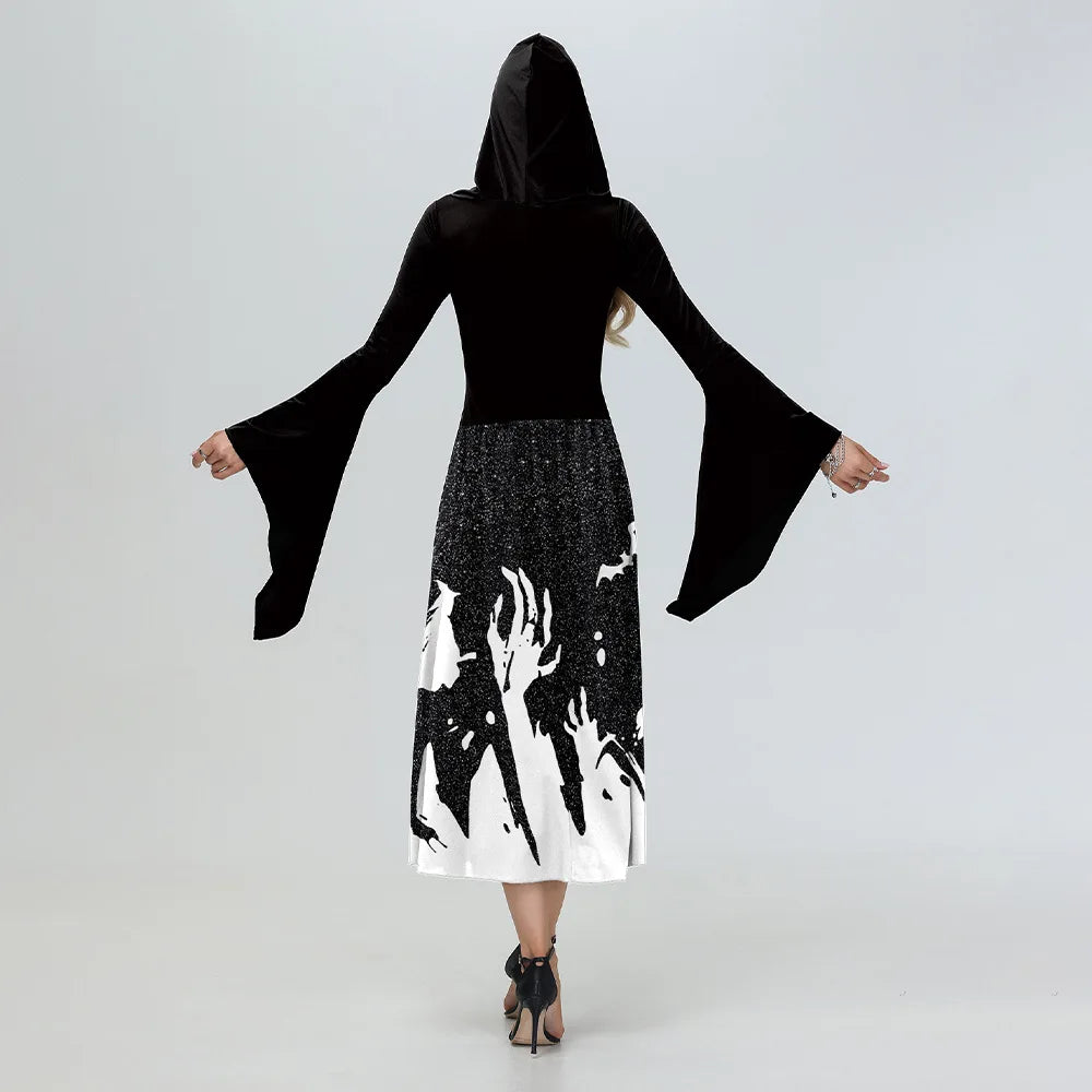 Person wearing a black and white dress with bell sleeves on a white background