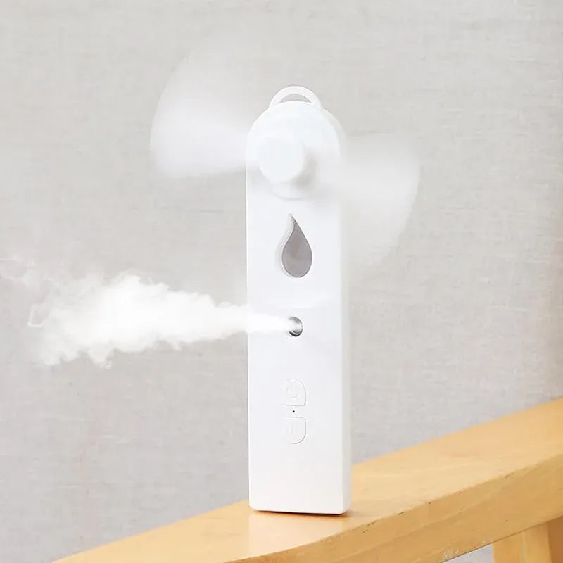 2-in-1 Handheld Fan & Face Mist Humidifier USB Rechargeable | Wahooly 2-in-1 Handheld Fan & Face Mist Humidifier — USB Rechargeable, Skin-Hydrating Portable Cooler