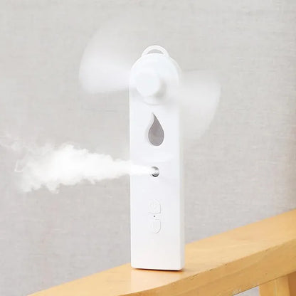 2-in-1 Handheld Fan & Face Mist Humidifier USB Rechargeable | Wahooly 2-in-1 Handheld Fan & Face Mist Humidifier — USB Rechargeable, Skin-Hydrating Portable Cooler
