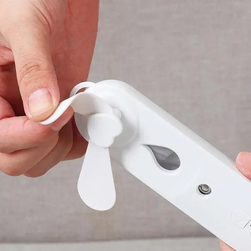 2-in-1 Handheld Fan & Face Mist Humidifier USB Rechargeable | Wahooly 2-in-1 Handheld Fan & Face Mist Humidifier — USB Rechargeable, Skin-Hydrating Portable Cooler